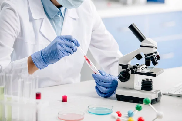 Cropped view of genetic consultant doing dna test in lab — Stock Photo