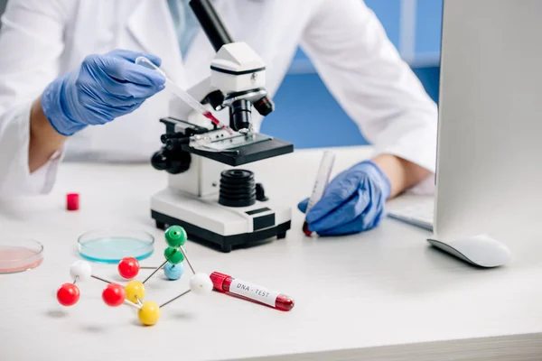 Cropped view of genetic consultant doing dna test in lab — Stock Photo