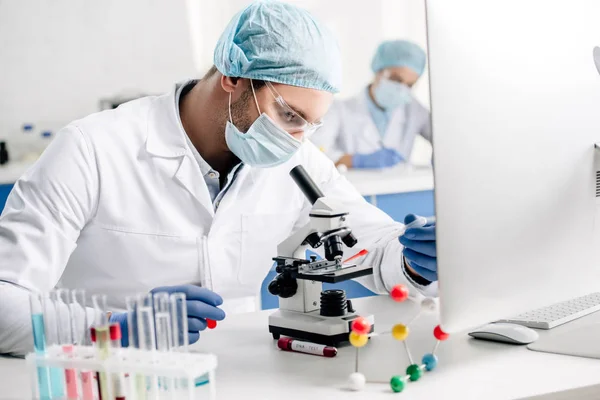 Selective focus of genetic consultant doing dna test in lab — Stock Photo