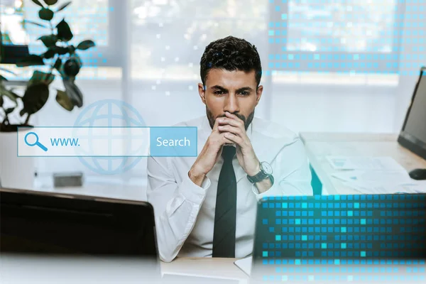 Pensive bi-racial trader looking at computers near search box — Stock Photo