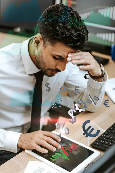 Pensive bi-racial trader using digital tablet with sell and buy letters — Stock Photo