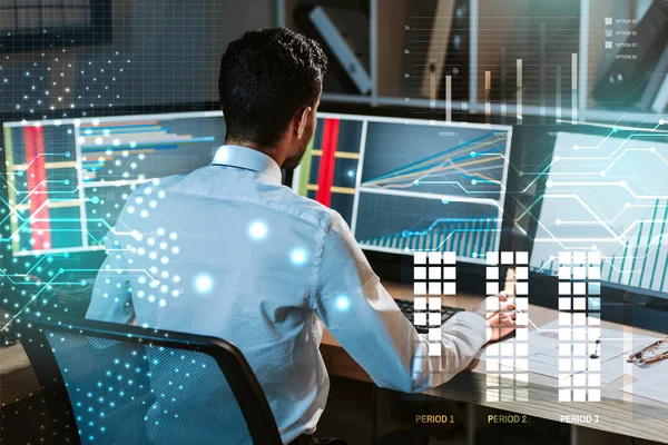 Back view of trader working near computer with graphs — Stock Photo