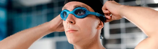 Panoramic shot of swimmer wearing goggles — Stock Photo