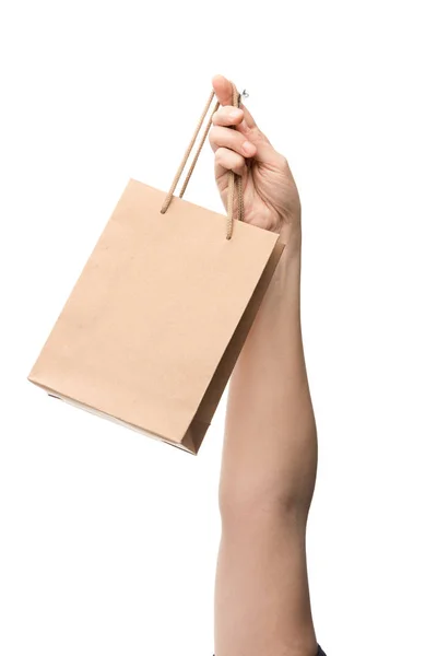 Vista cortada da mulher segurando saco de compras isolado no branco — Fotografia de Stock
