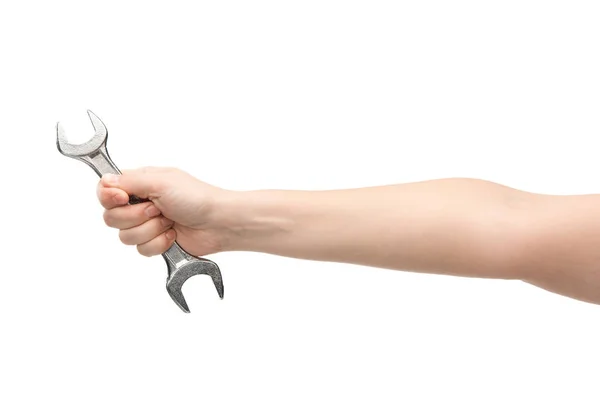 Cropped view of woman holding spanner isolated on white — Stock Photo