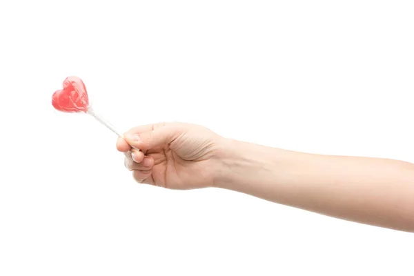 Cropped view of woman holding lollipop isolated on white — Stock Photo