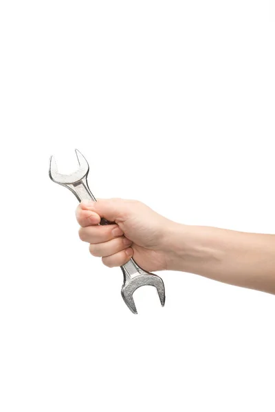Cropped view of woman holding spanner isolated on white — Stock Photo