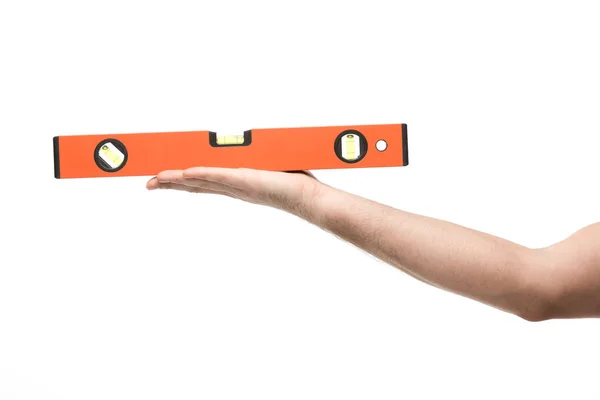 Cropped view of woman holding spirit level isolated on white — Stock Photo