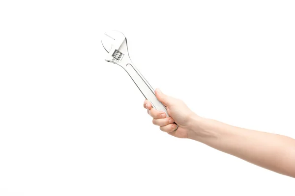 Cropped view of woman holding spanner isolated on white — Stock Photo