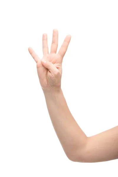 Vue recadrée de la femme montrant quatre doigts geste isolé sur blanc — Photo de stock