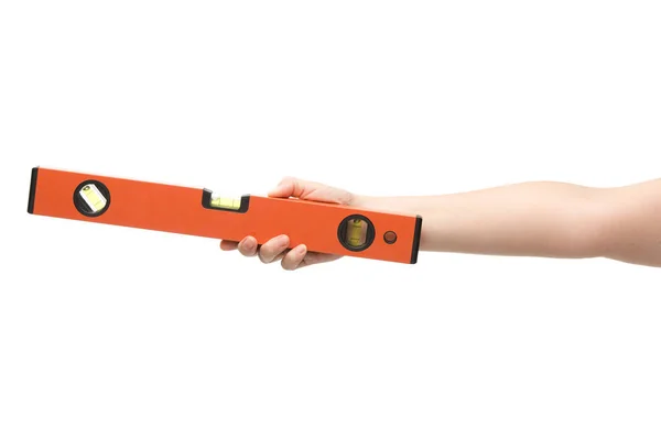 Cropped view of woman holding spirit level isolated on white — Stock Photo