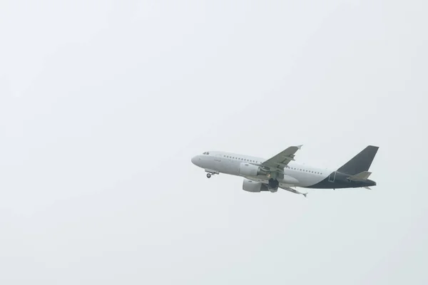 Flight departure of airplane with sky at background — Stock Photo