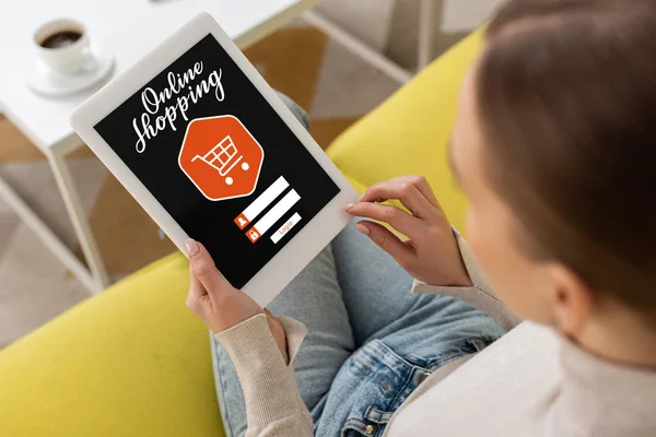 Overhead view of woman using digital tablet with online shopping lettering — Stock Photo