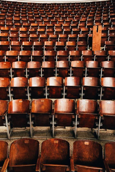 Wooden seats with numbers at circle amphitheater — Stock Photo