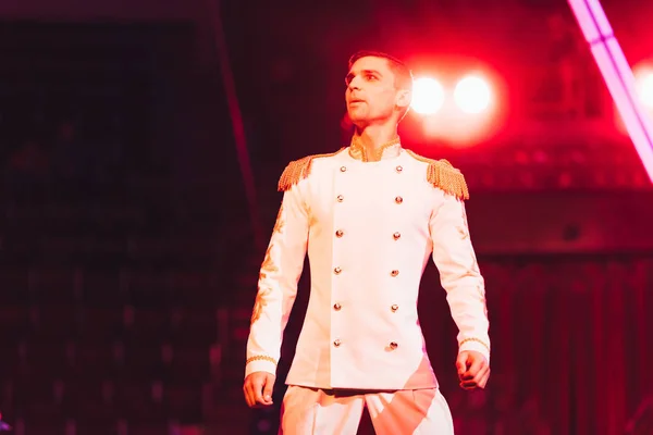 KYIV, UKRAINE - NOVEMBER 1, 2019: Low angle view of handsome performer looking away on circus arena — Stock Photo