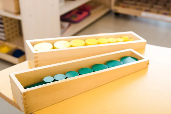 Selective focus of wooden educational games on yellow desk in class — Stock Photo