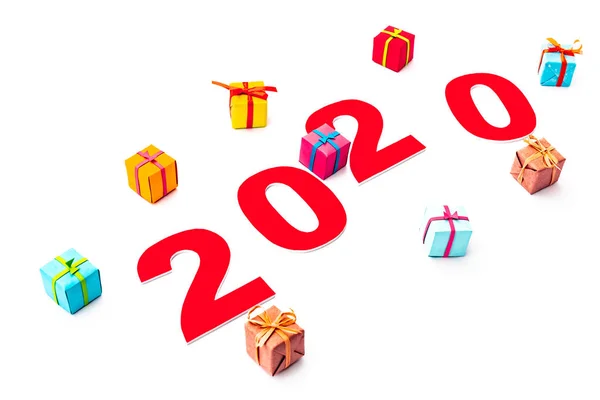 Red 2020 number and gifts isolated on white — Stock Photo