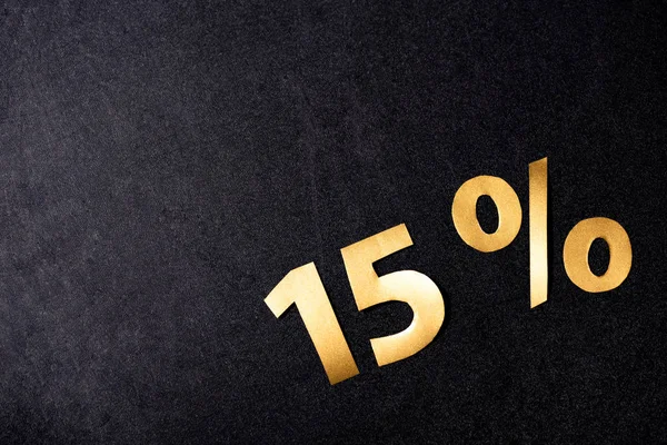 Top view of golden 15 percent signs on black background — Stock Photo