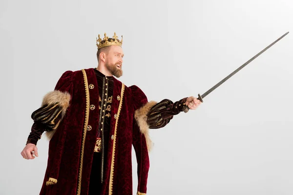 King with crown fighting with sword isolated on grey — Stock Photo