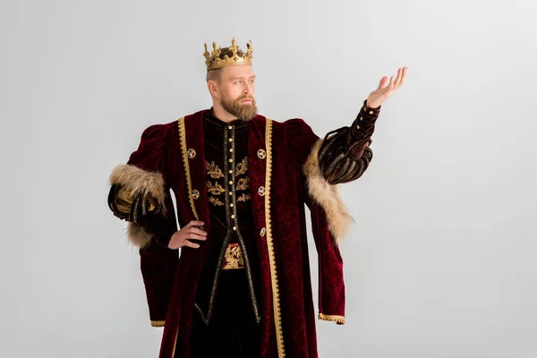 King with crown pointing with hand isolated on grey — Stock Photo