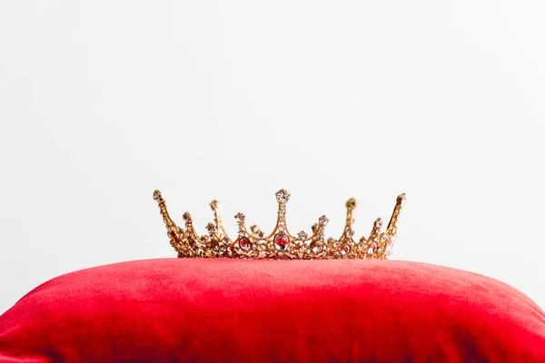 Royal crown on red pillow isolated on white with copy space — Stock Photo