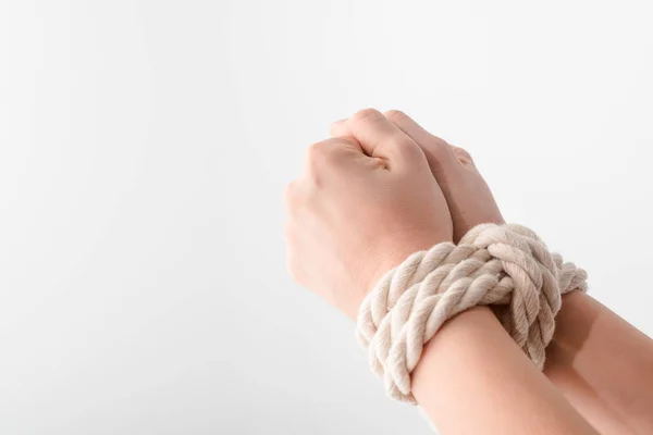 Cropped view of woman with tied hands isolated on white, human rights concept — Stock Photo