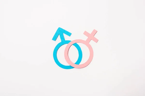 Símbolos de gênero azul e rosa isolados no conceito de igualdade sexual branca — Fotografia de Stock
