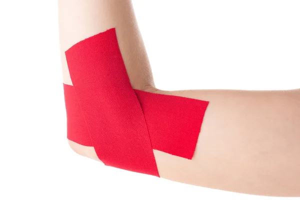 Cropped view of kinesiology tapes on female cubit isolated on white — Stock Photo