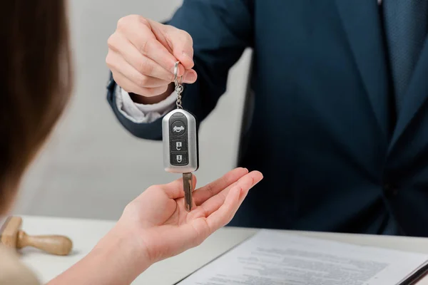 Cropped view of realtor giving key to client, leasing concept — Stock Photo