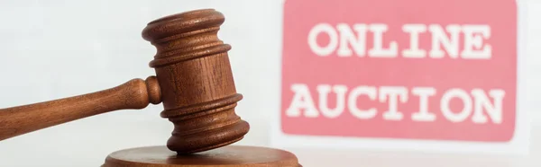 Panoramic shot of gavel and card with online auction lettering — Stock Photo