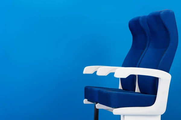 Bright and colorful seats isolated on blue with copy space — Stock Photo