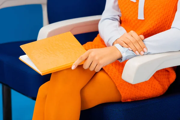 Cropped view of african american in retro dress holding book — Stock Photo