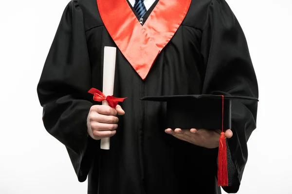 Vista frontal del estudiante con gorra de graduación y diploma aislado en blanco - foto de stock