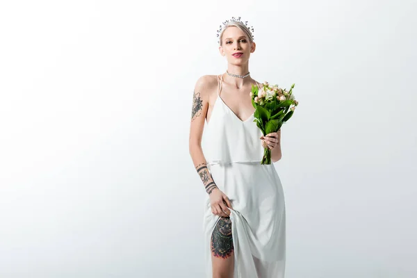 Beautiful tattooed bride with bouquet isolated on white — Stock Photo