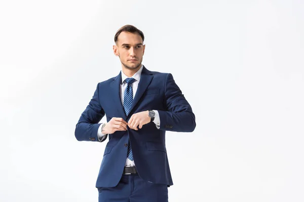 Succès jeune homme d'affaires en costume bleu isolé sur blanc — Photo de stock