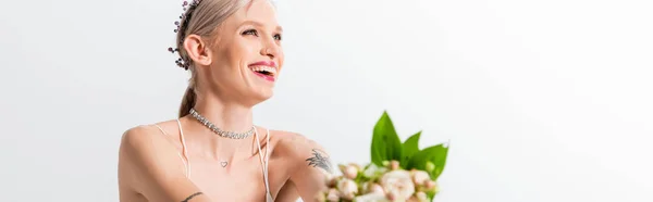 Selective focus of happy beautiful tattooed bride and floral bouquet on white, panoramic shot — Stock Photo