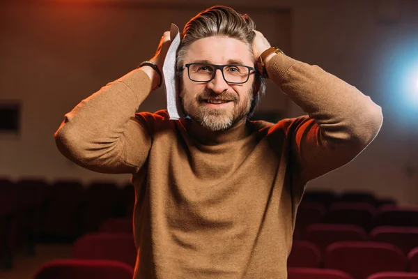 Handsome emotional stage director with scenario on rehearse in theater — Stock Photo