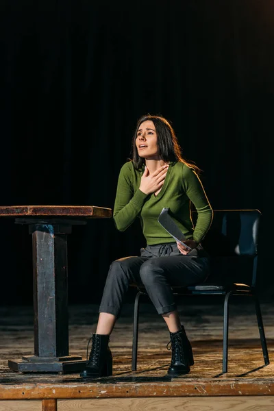 Emotional actress performing role on stage in theatre — Stock Photo