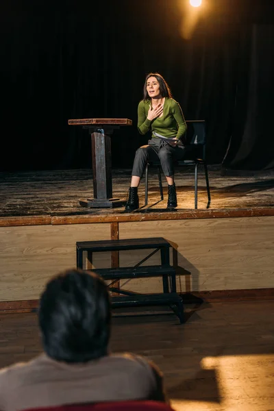 Selective focus of professional theater director and attractive actress performing role on stage — Stock Photo