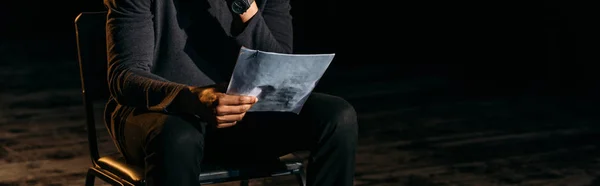 Panoramic shot of african american actor holding scenario on stage during rehearse — Stock Photo