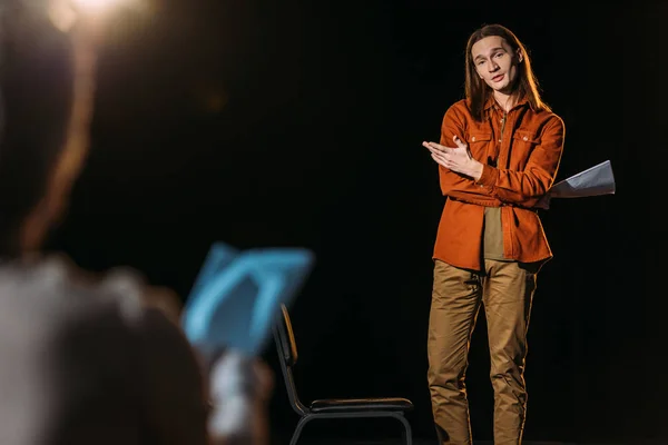 Selective focus of handsome actor on casting with theater director — Stock Photo