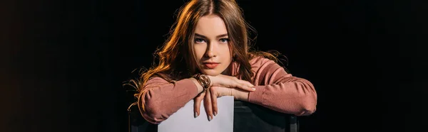 Panoramic shot of attractive young actress with scenario, isolated on black — Stock Photo