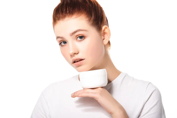 Attractive female teenager with perfect skin holding plastic container with cosmetic cream, isolated on white — Stock Photo