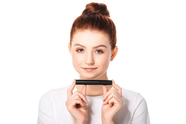 Beautiful happy teen girl holding mascara, isolated on white — Stock Photo