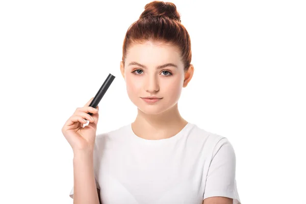 Beautiful teen girl holding mascara, isolated on white — Stock Photo