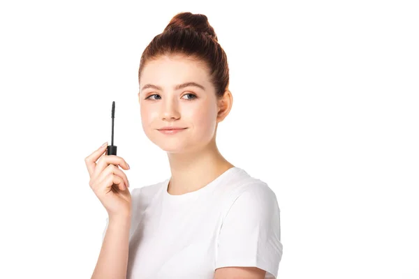 Beautiful smiling teen girl holding mascara, isolated on white — Stock Photo