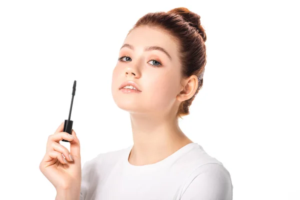 Attractive teen girl holding mascara, isolated on white — Stock Photo