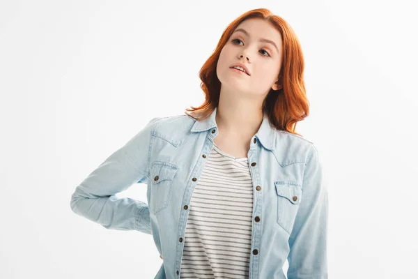 Bella adolescente pensosa in abiti di jeans, isolata su bianco — Foto stock