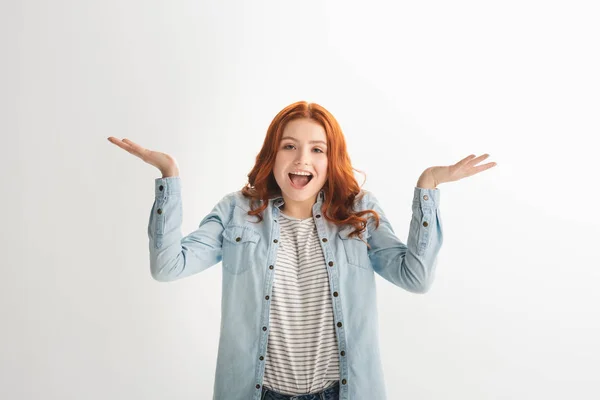 Emotional redhead teen girl with shrug gesture, isolated on white — Stock Photo