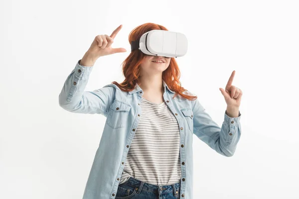 Beautiful emotional teenager gesturing and using virtual reality headset, isolated on white — Stock Photo